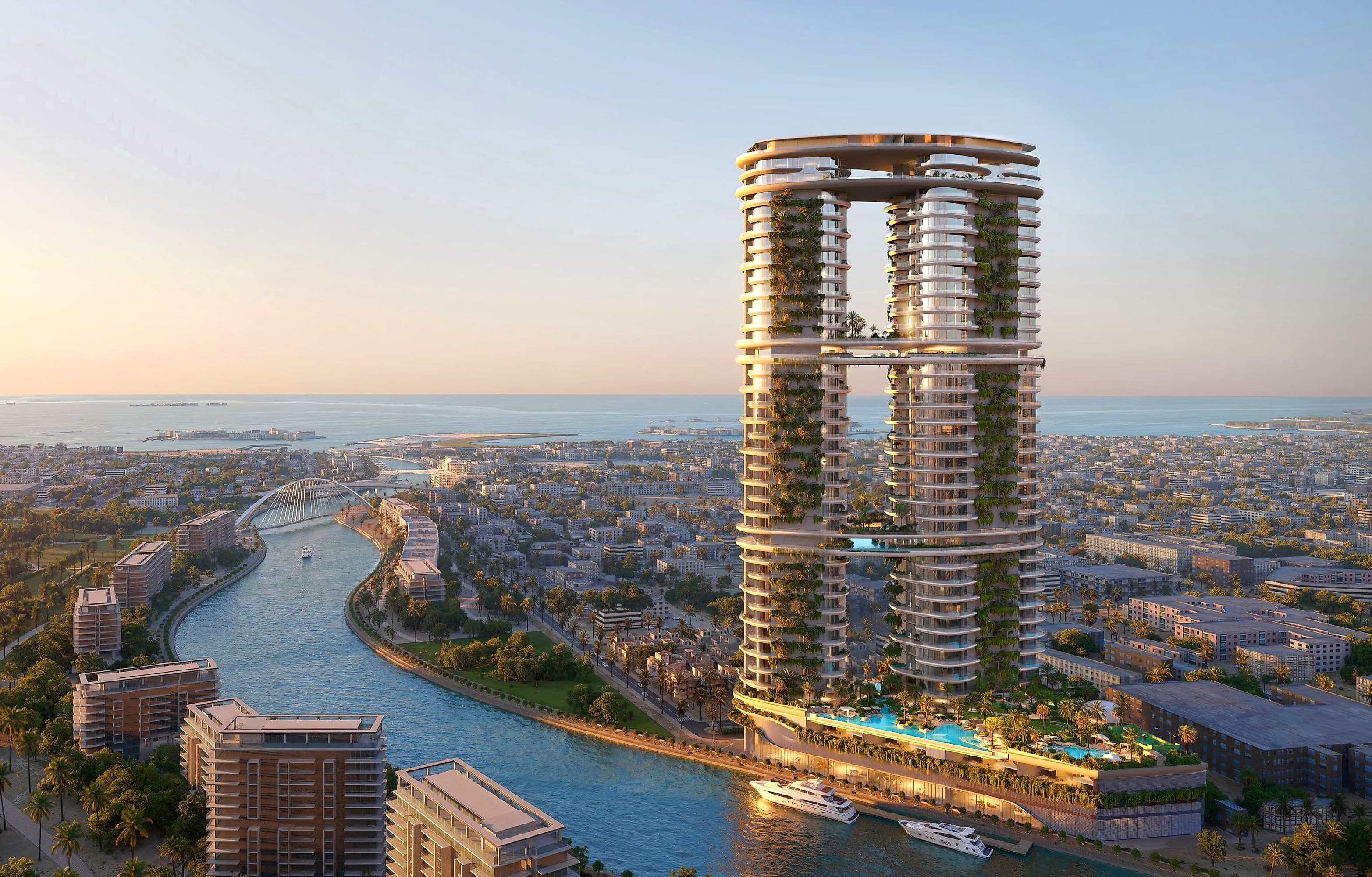 Amali Residences rising above the Dubai Water Canal at golden hour