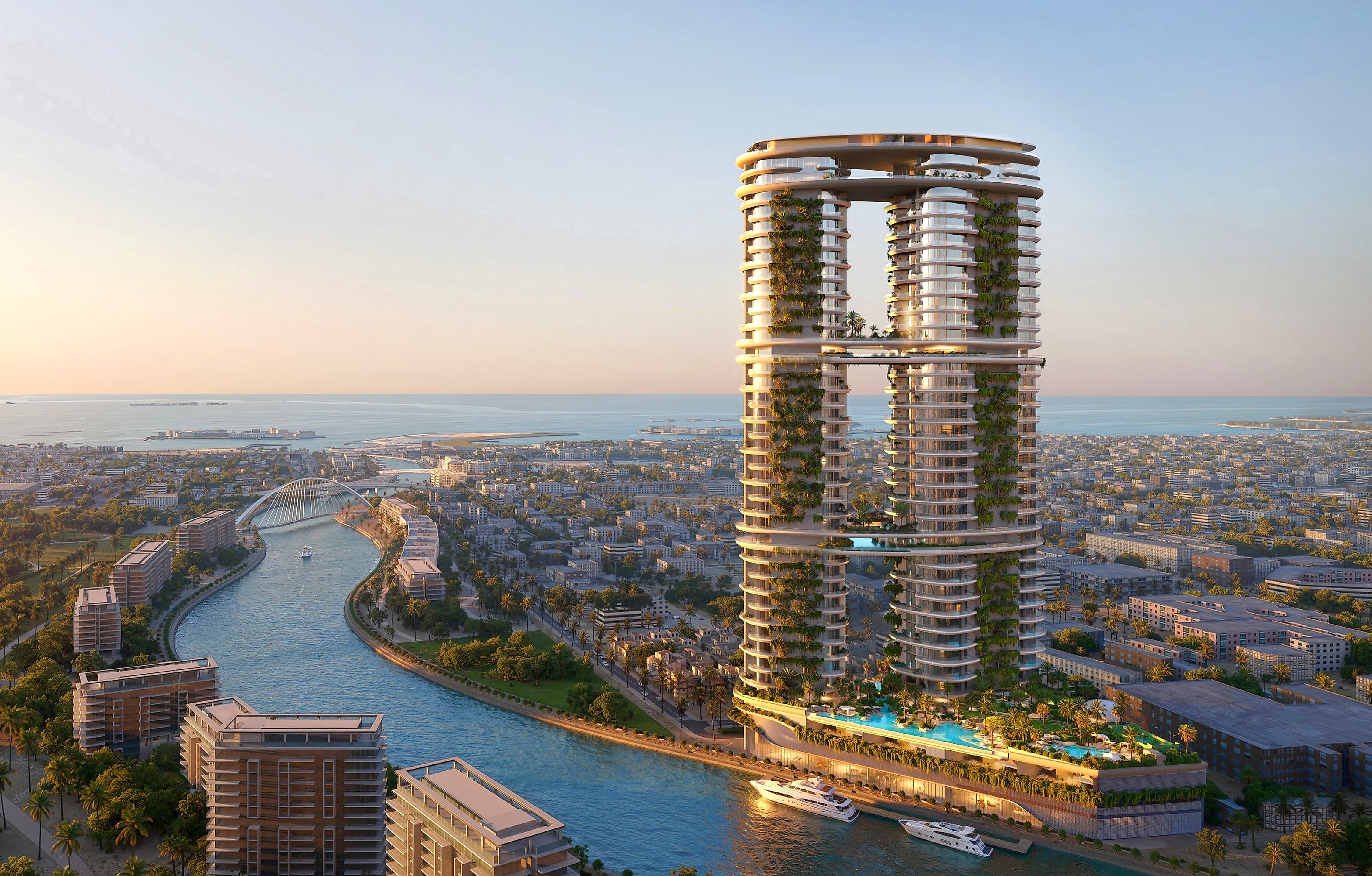 Amali Residences rising above the Dubai Water Canal at golden hour